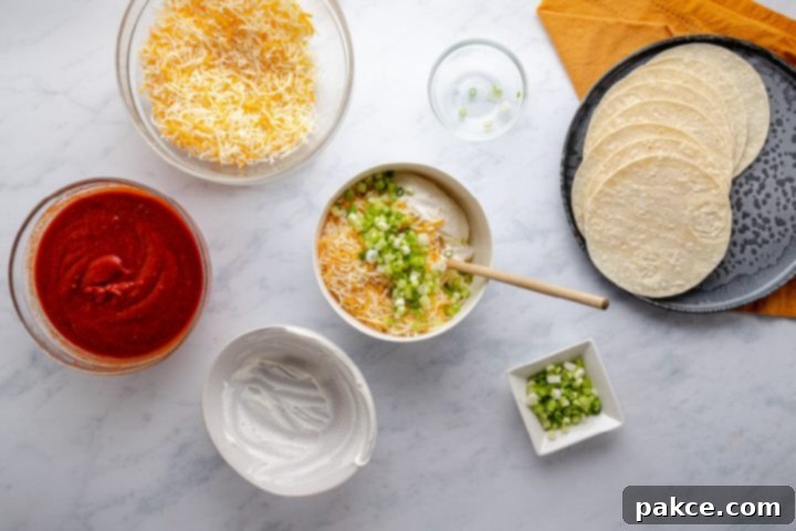 Cheese and Onion Enchiladas 4 A bowl filled with a creamy, cheesy mixture of shredded Mexican blend cheese, sour cream, and chopped green onions, perfectly combined and ready to be used as enchilada filling.
