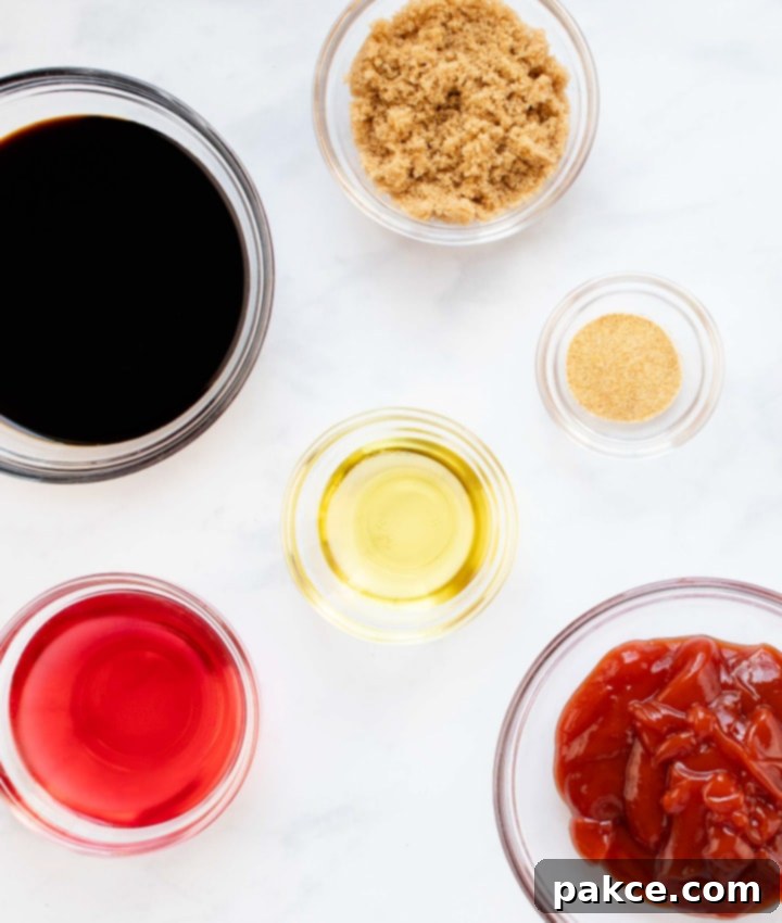 soy-garlic-beef-marinade-post-vert-min Overhead shot of small bowls holding individual ingredients for the soy garlic beef marinade: red wine vinegar, soy sauce, brown sugar, olive oil, garlic salt, and ketchup, ready to be combined.