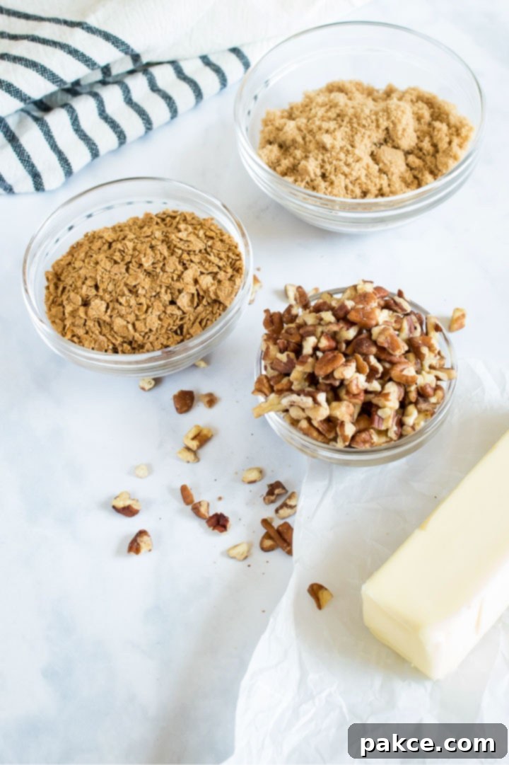 Streusel topping ingredients displayed: melted butter, brown sugar, chopped pecans, and crushed cereal, ready to be mixed