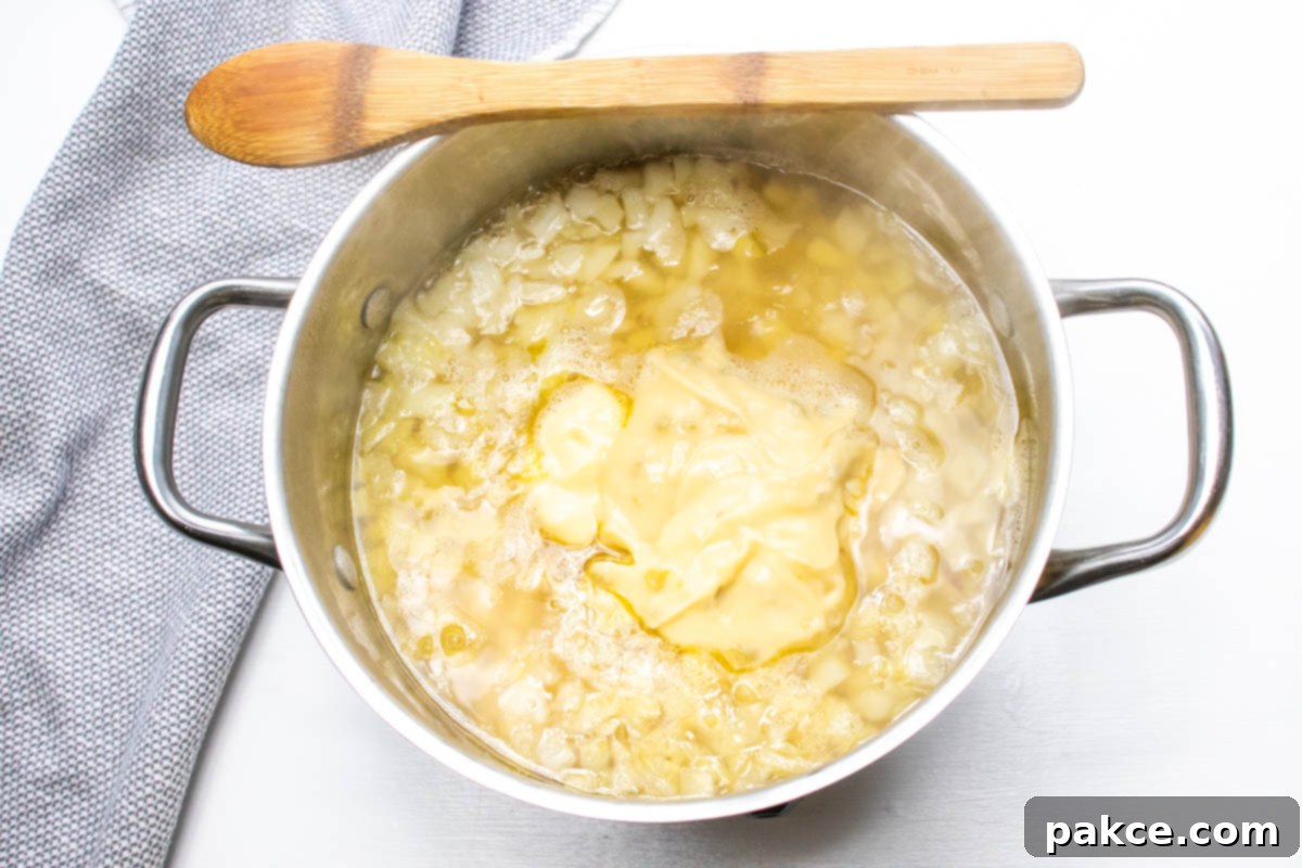 30 Minute Crispy Hash Brown Potato Soup 3 The potato soup after the cream soups and evaporated milk have been added, creating a thicker, creamy base.