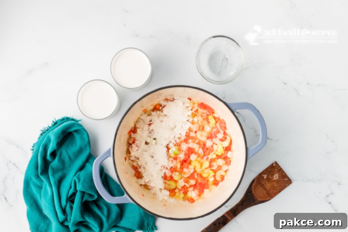 Recreate Olive Garden's Chicken Gnocchi Soup at Home 5 Enamel Dutch oven with chopped onion, red bell pepper, celery, and minced garlic sautéed in butter and flour added to thicken.