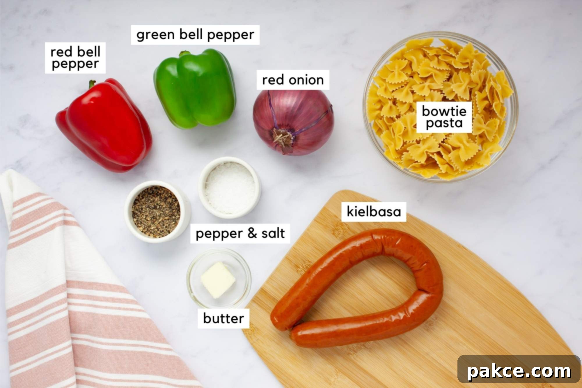 Hearty 20 Minute Kielbasa Pepper Pasta 3 Ingredients for Kielbasa Pepper Pasta: bowtie pasta, kielbasa, red pepper, green pepper, red onion, butter, salt, and pepper.