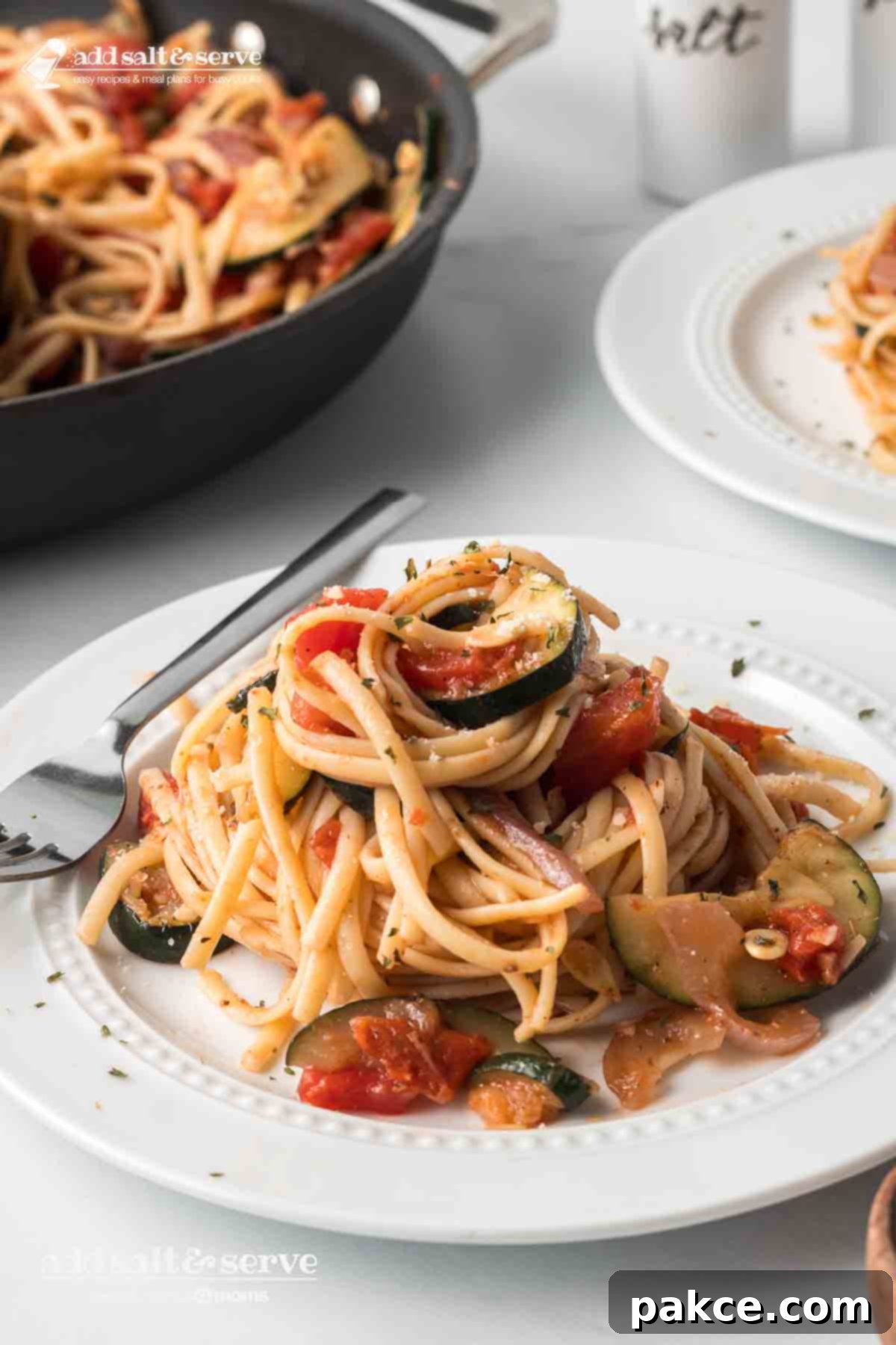 Stovetop zucchini linguine on a plate.