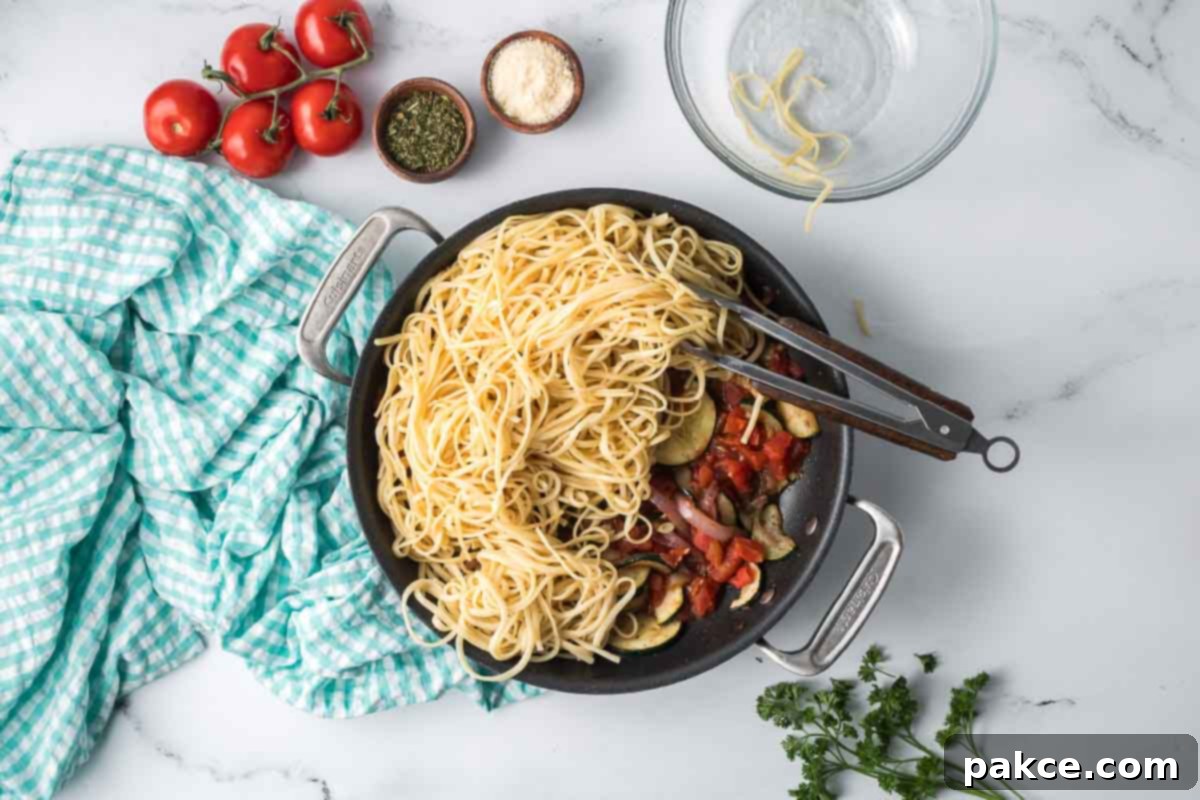 Spiralized Zucchini Linguine 8 Hot cooked linguine added to a skillet with canned diced tomatoes, sautéd red onion and zucchini, garlic, and herbs.