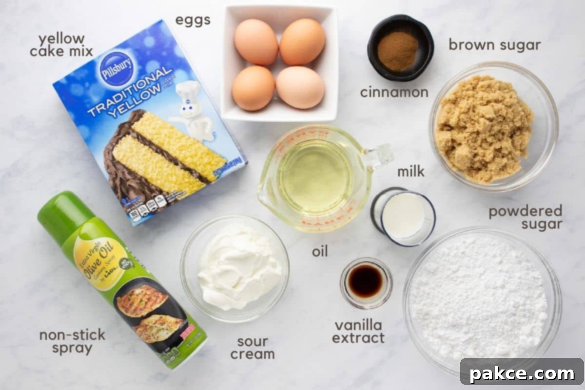 Honey-Glazed Cinnamon Swirl Cake 3 Ingredients needed to make honey bun cake: yellow cake mix, eggs, cooking oil, sour cream, cinnamon, brown sugar, powdered sugar, milk, vanilla, and non-stick baking spray.