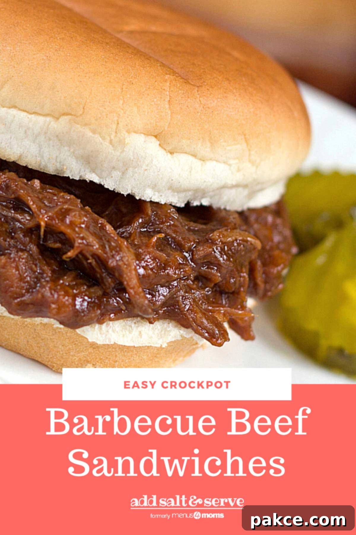 Barbecue Roast Beef Sandwich garnished with two pickle slices.