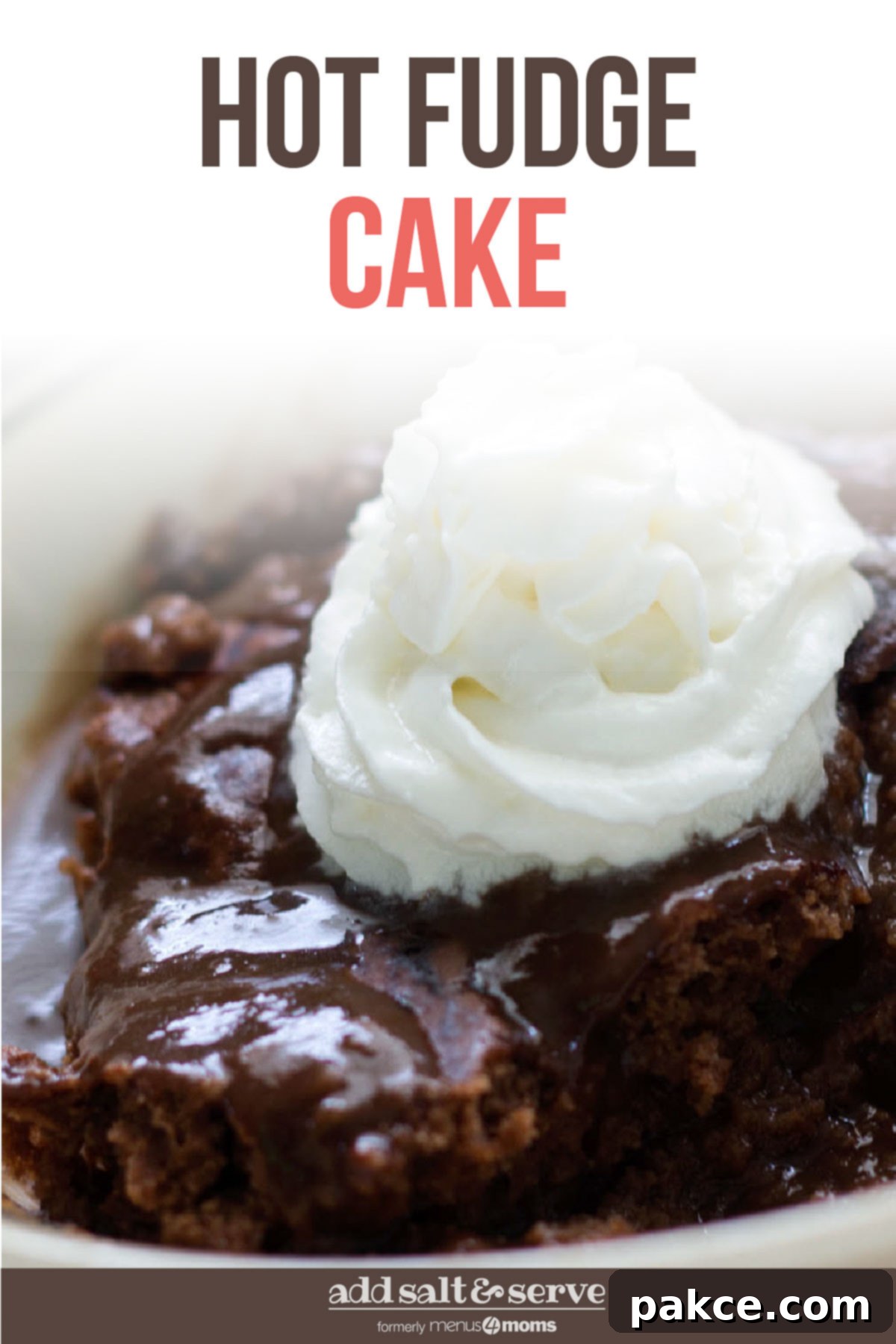 Homemade Hot Fudge Cake topped with whipped cream and cherry