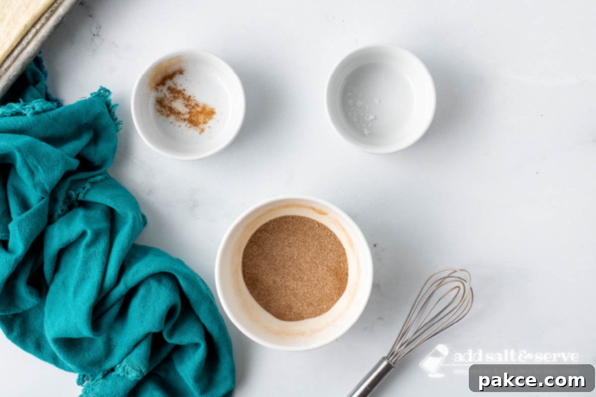 Effortless Cinnamon Sticks from Pizza Dough 4 Mixture of sugar and cinnamon in a bowl.