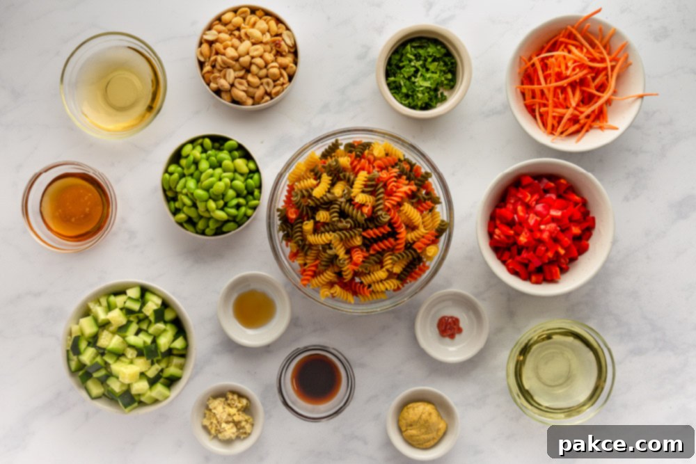 Thai Pasta Salad with Sesame Ginger Dressing 3 Ingredients laid out for Thai Pasta Salad with Ginger Sesame Dressing