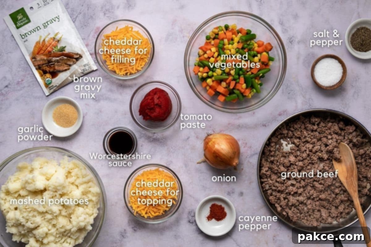 Freeze and Feast Shepherds Pie 3 Ingredients for SHepherd's Pie: ground beef, onion, cayenne pepper, tomato paste, cheddar cheese, Worcestershire sauce, garlic powder, brown gravy mix, mashed potatoes, salt, and pepper.