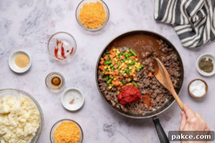 Freeze and Feast Shepherds Pie 6 ingredients for preparing shepherd's pie in a skillet