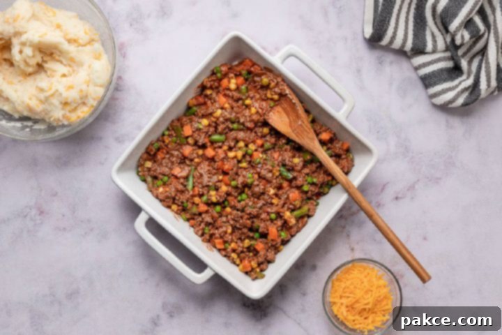 Freeze and Feast Shepherds Pie 7 beef and vegetable mixture for shepherd's pie in a baking pan