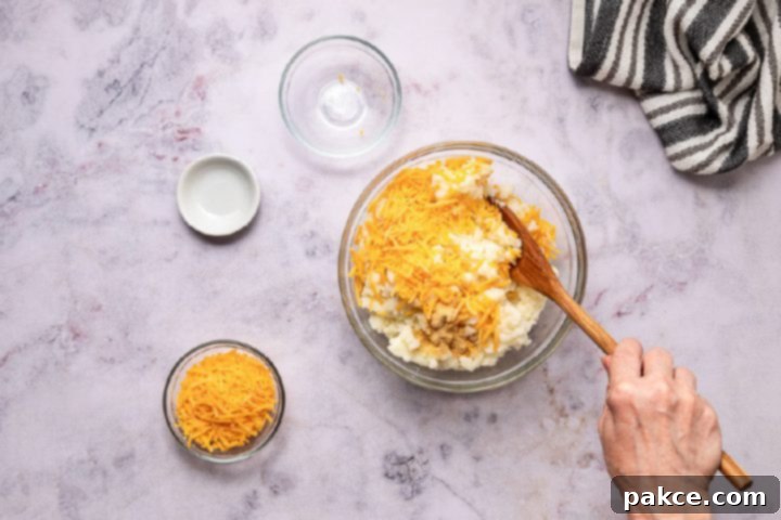 Freeze and Feast Shepherds Pie 8 mixing cheese into mashed potatoes