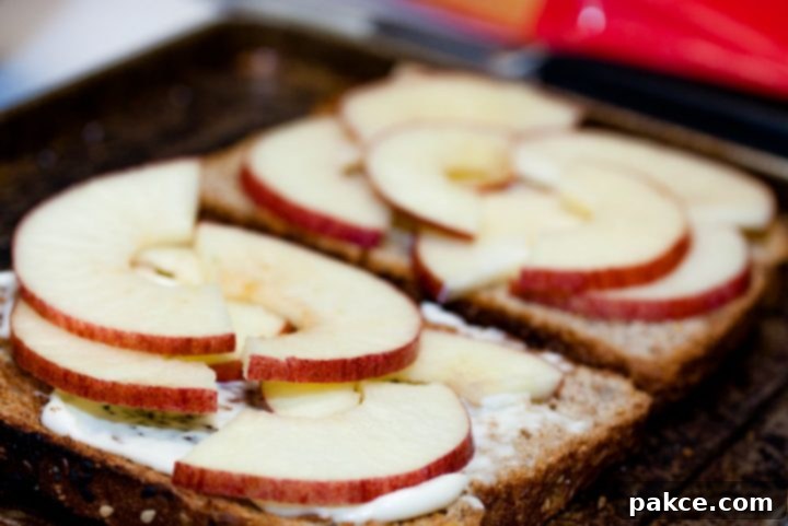 Toast with mayo and sliced apples and text Add Salt & Serve