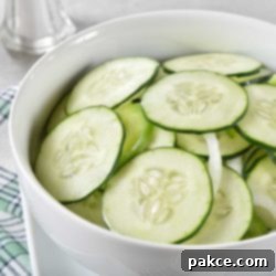 Cucumber and onion salad in a bowl, a refreshing side dish.