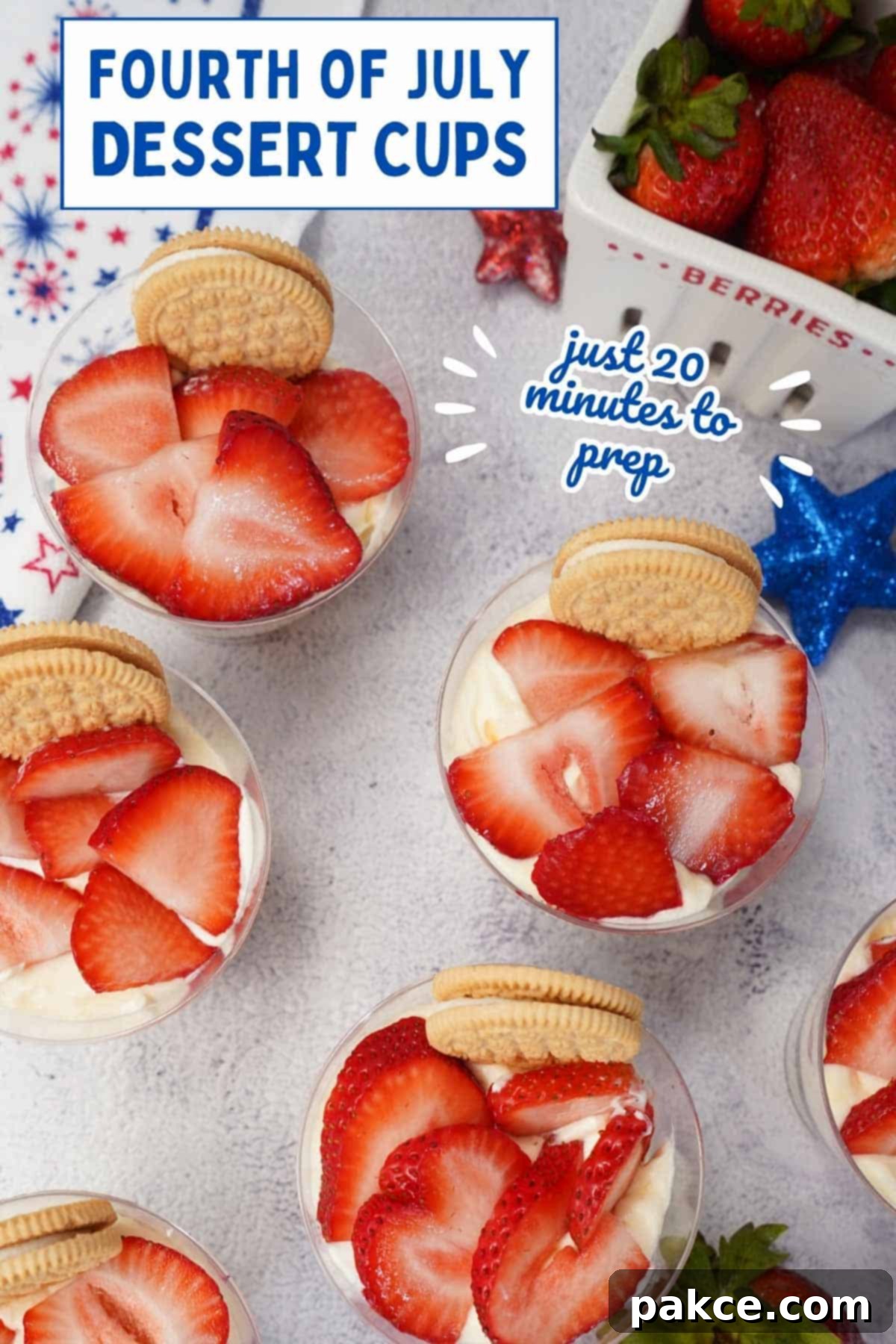 Red White and Blue Celebration Cups 6 Red, white, and blue parfaits in plastic cups topped with sliced strawberries and a sandwich cookie with text Fourth of July Dessert Cups - just 20 minutes to prep.