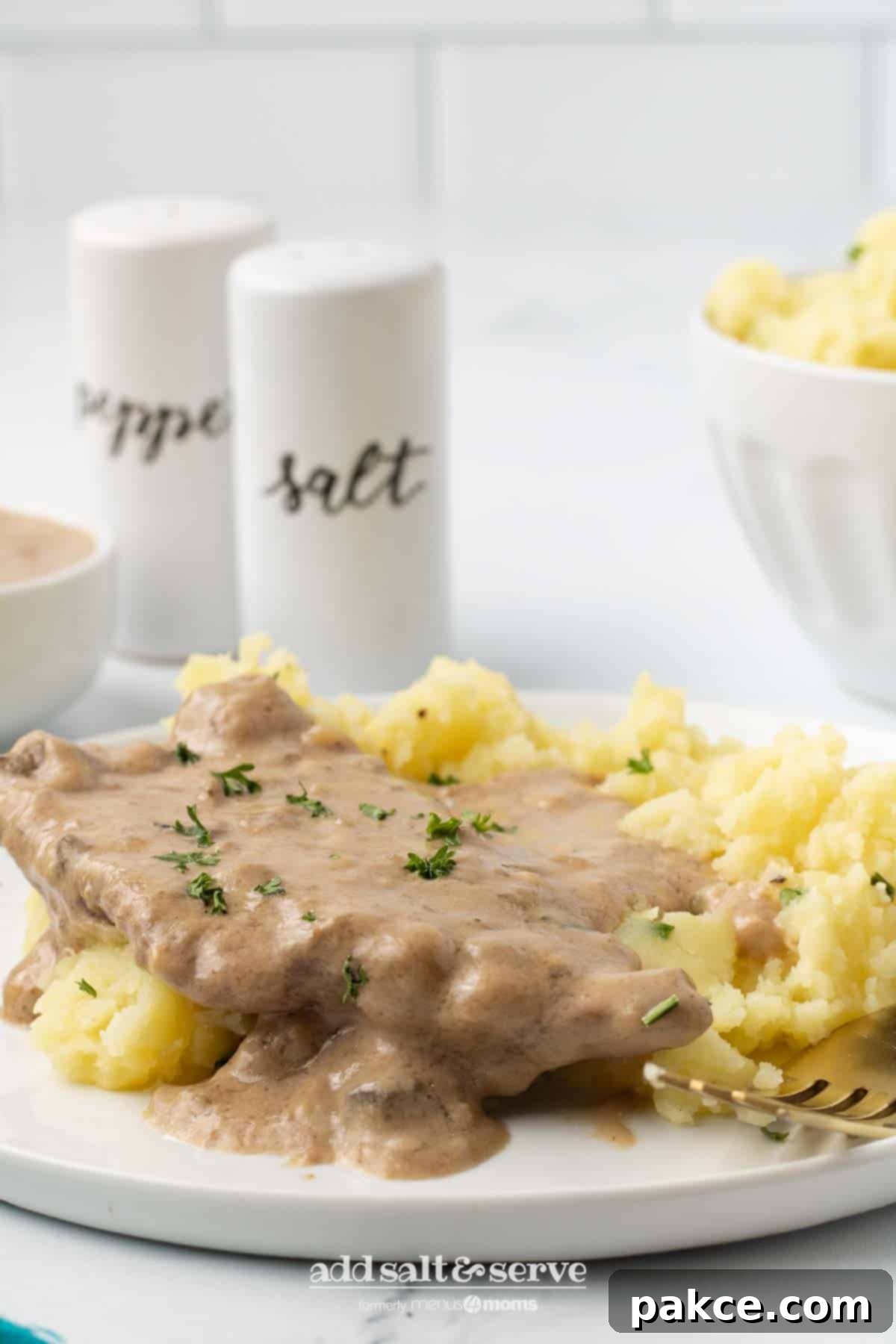 Slow Cooker Creamy Mushroom Cube Steak 8 Cube steak with mushroom soup gravy served over mashed potatoes.