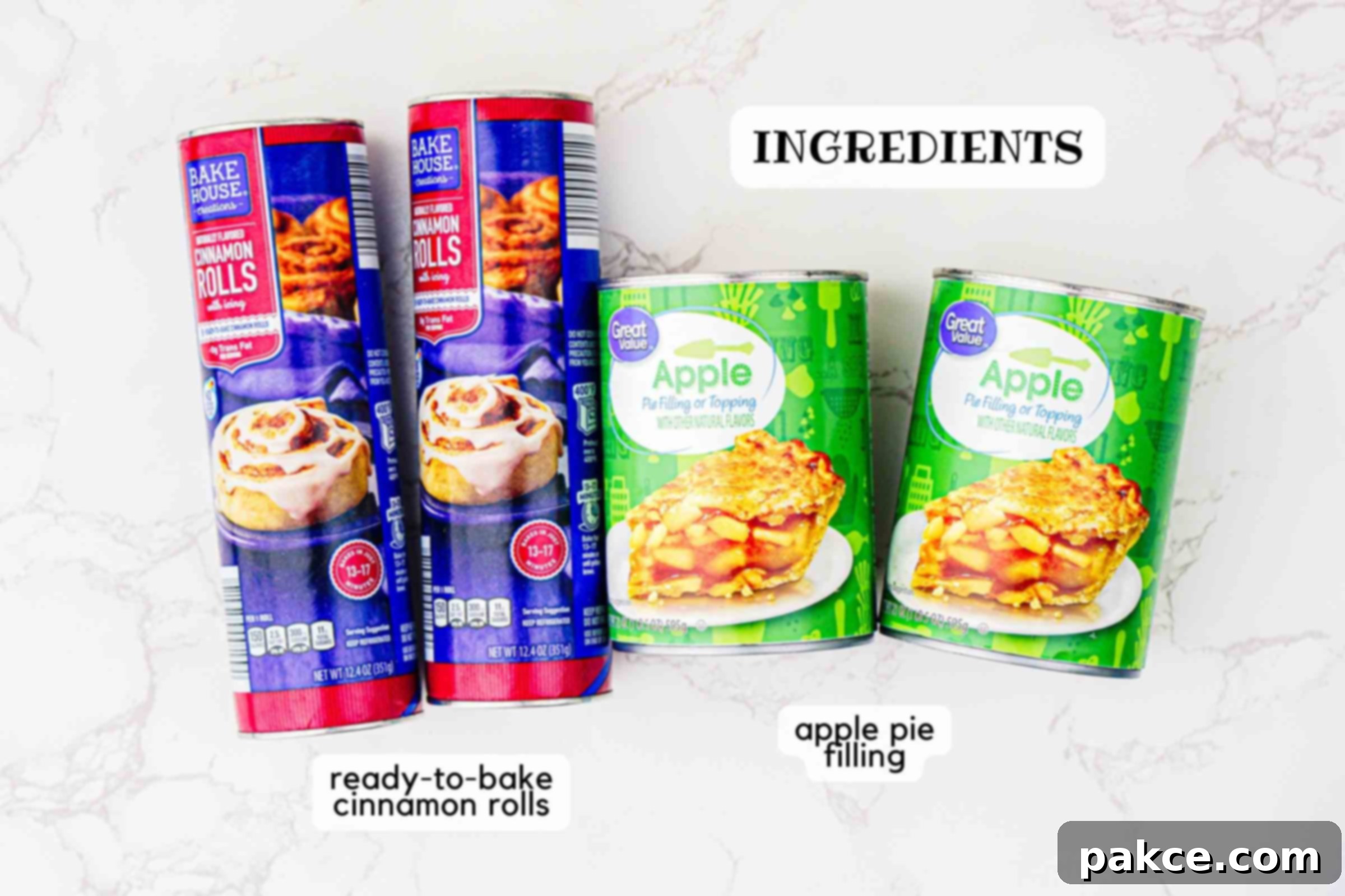 Two canisters of ready-to-bake cinnamon rolls and two cans of apple pie filling, the only ingredients needed for this bake.