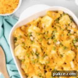 Creamy Turkey Tortellini Bake 9 A dish of Leftover Turkey Tortellini Casserole, garnished and ready to serve, showcasing the golden cheese topping and creamy interior.