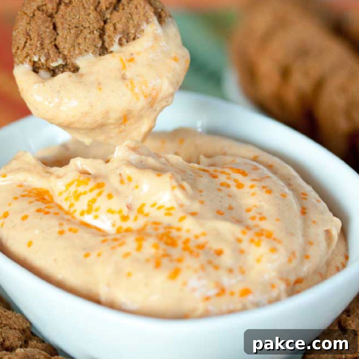 Pumpkin Cheesecake Dip with gingersnap for dipping