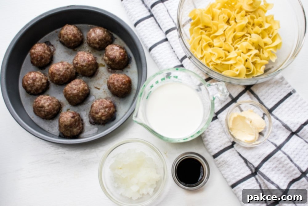 Creamy Balsamic Meatballs ingredient mise en place Meatballs in a pan and bowls of ingredients: cooked egg noodles, cream, chopped onion, balsamic vinegar, and butter