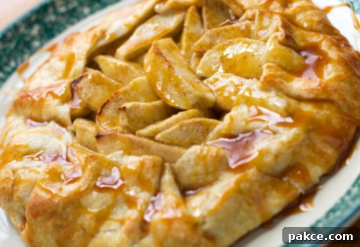 Baked apple galette drizzled with caramel sauce, a perfect fall dessert