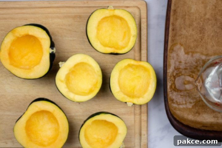 easy-microwave-acorn-squash-ip-4-min Acorn sqush sliced in half and cleaned of seeds and pulp