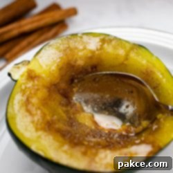 Easy Microwave Acorn Squash 7 Candied acorn squash with a spoon