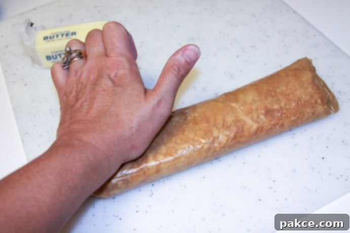 Crushing crackers in a wax paper sleeve