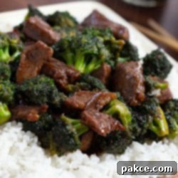 Leftover Steak Beef and Broccoli Makeover 7 Easy Beef and Broccoli Stir Fry with Leftover Steak served over rice with chopsticks.