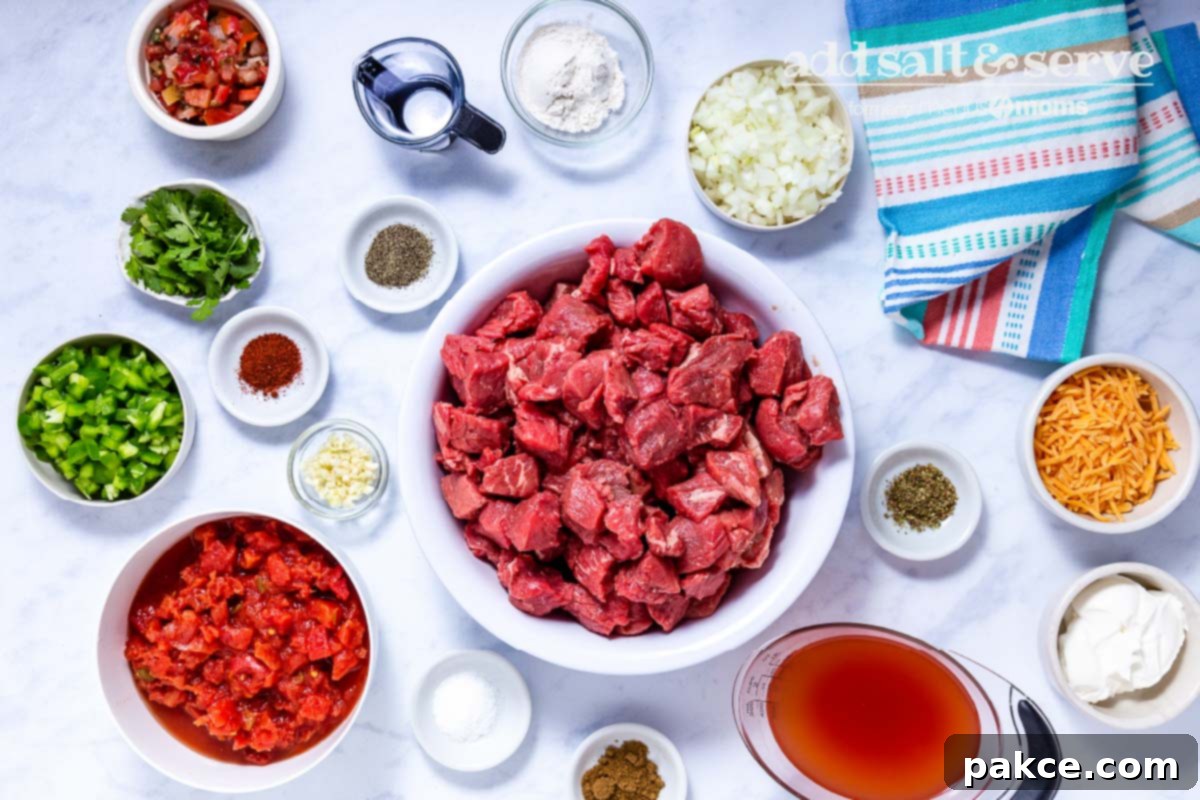 Effortless Slow Cooker Carne Guisada 2 Overhead view of ingredients for Carne Guisada Crock Pot.