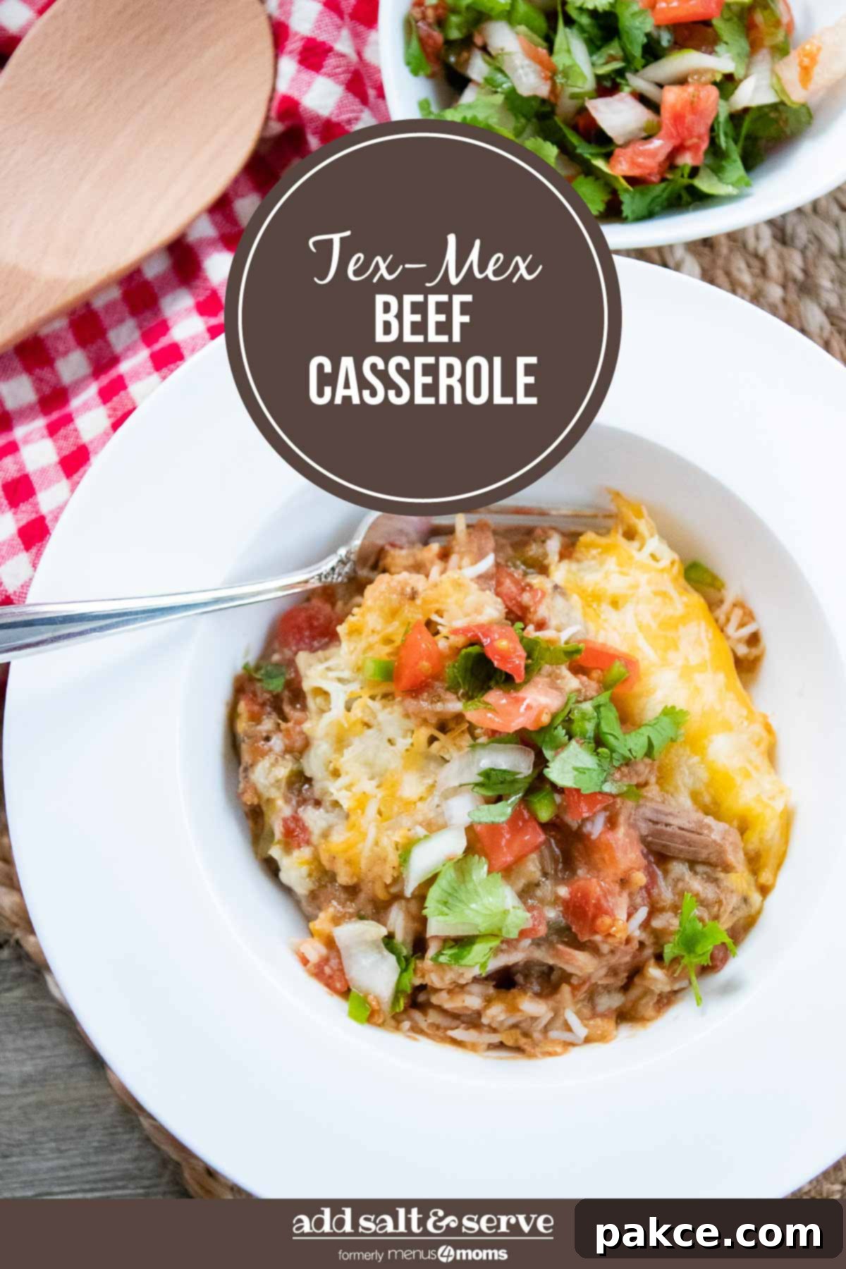 Spicy Tex-Mex Beef Bake 4 A large serving of Tex-Mex Beef Casserole, showcasing the golden-brown melted cheese, beef, and rice layers. Garnished with fresh cilantro and pico de gallo, ready to be served.