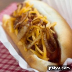 Ranch Hand's Dogs 2 A delicious Cowboy Hot Dog, loaded with sauteed onions and cheddar cheese, ready to be enjoyed.