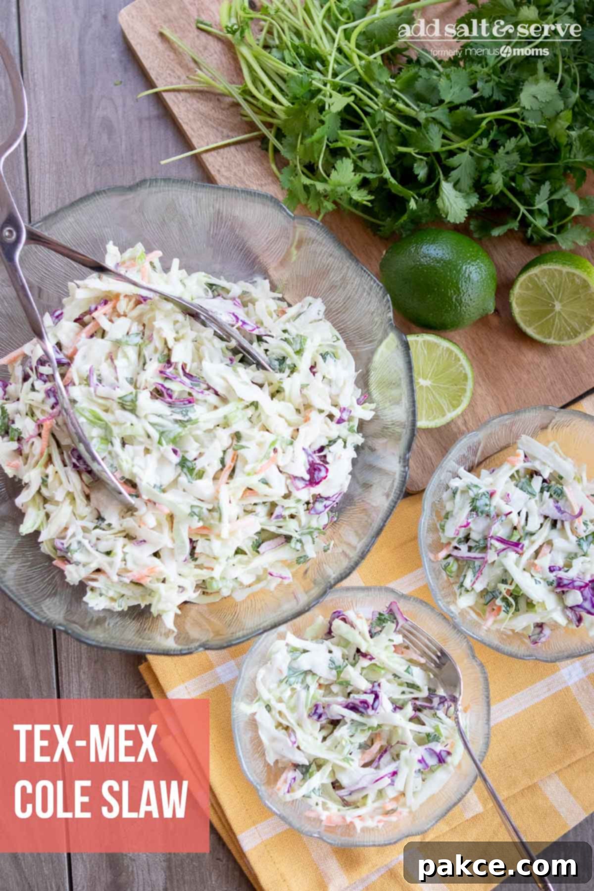 A large bowl of vibrant Tex-Mex Cole Slaw garnished with lime wedges and fresh cilantro leaves