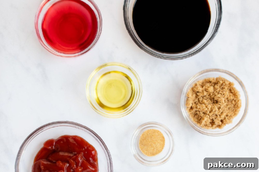 Texas Fajitas 2 Collection of fresh ingredients for a homemade soy garlic marinade for beef and chicken, including soy sauce, red wine vinegar, ketchup, brown sugar, garlic powder, and olive oil.