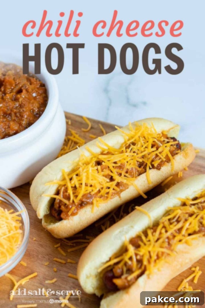 Two hot dogs in buns topped with chili and shredded cheese, a bowl of shredded cheese, and a bowl of chili. Text Chili Cheese Hot Dogs Add Salt & Serve formerly Menus4Moms