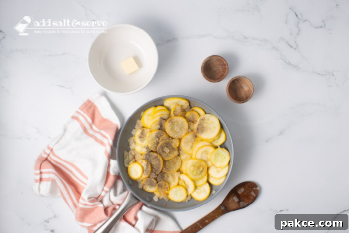 20-Minute Velvety Summer Squash Ravioli 6 Yellow squash, chopped onion, salt, and pepper in a skillet with a wooden spoon and a bowl with a pat of butter.