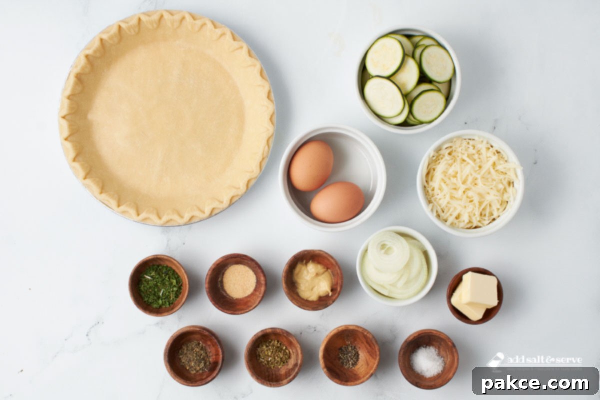 Golden Zucchini Cheese Quiche 3 Fresh ingredients for Zucchini Quiche laid out on a wooden board.
